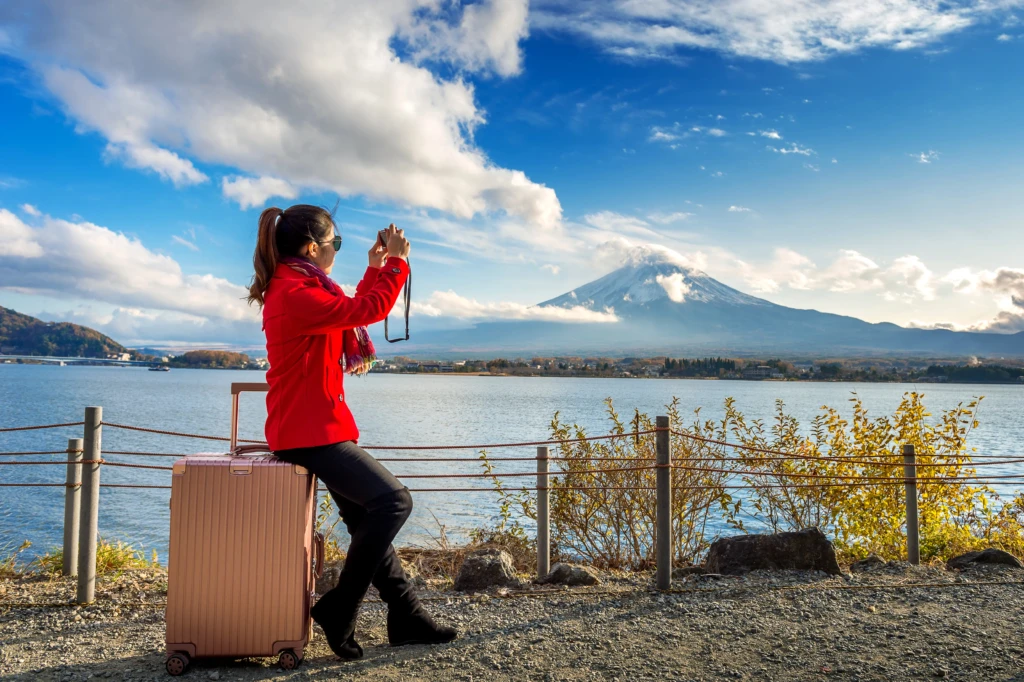 woman-take-photo-fuji-mountains-autumn-japan-travel-concept
